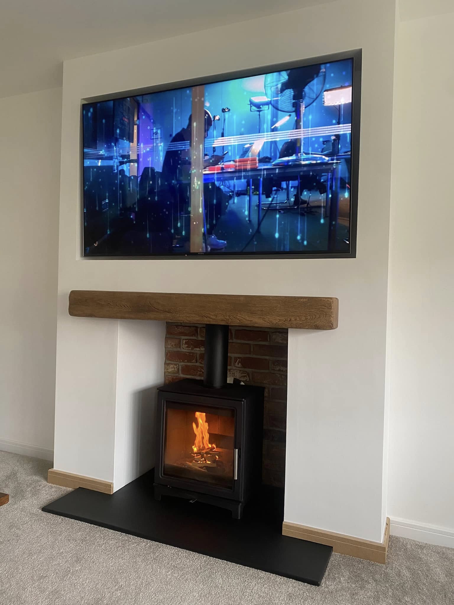 Feature Chimney Breast with Wood Burning Stove and Inset TV