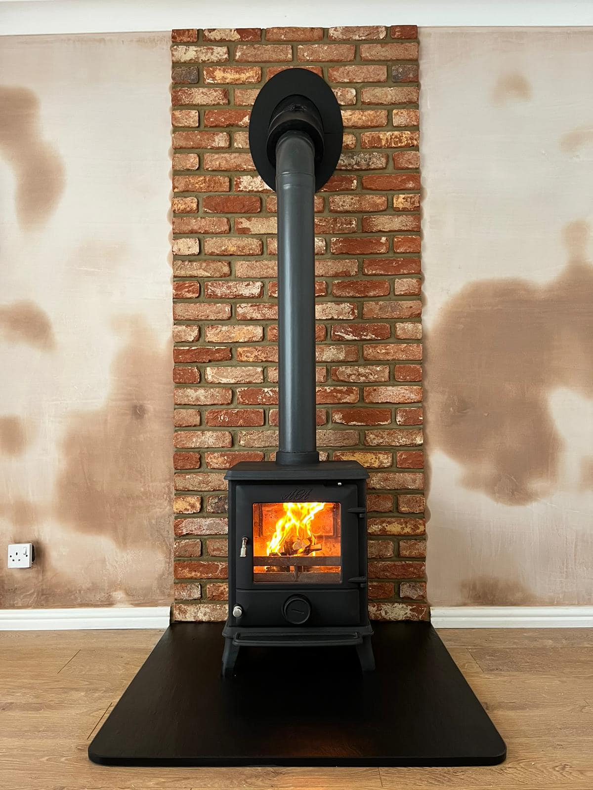 Fireplace Refresh with Shaped Slate Hearth and Brick Slip Back Panel