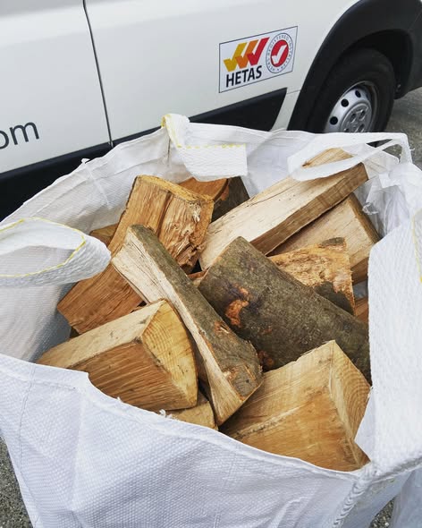 First-Floor Stove Media Wall with Built-In Log Storage