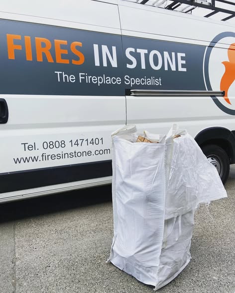 First-Floor Stove Media Wall with Built-In Log Storage
