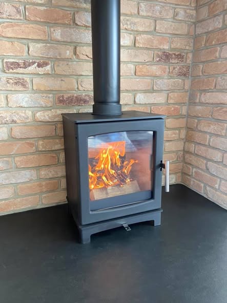 Summerhouse Stove Installation with Reclaimed Brick Heat Shield