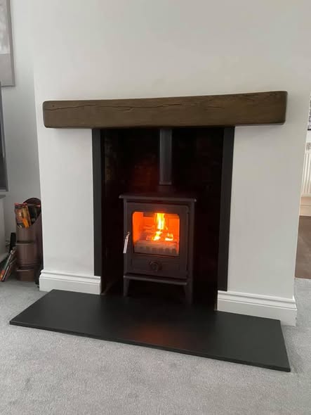 Opened Chimney Breast with Original Brickwork and Stove